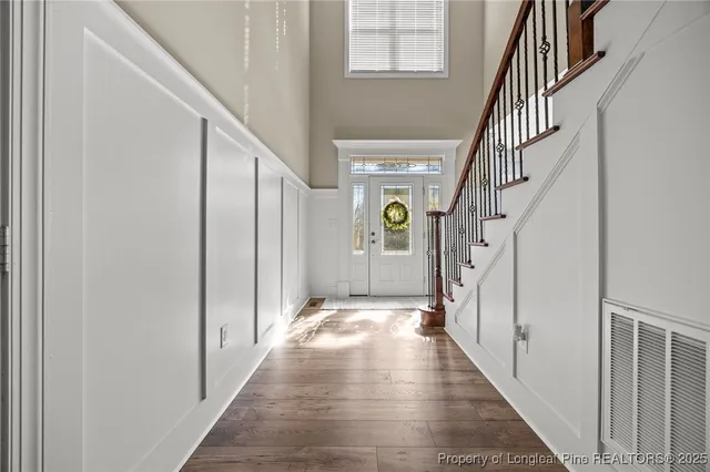 a kitchen with stainless steel appliances granite countertop a sink a stove and cabinets
