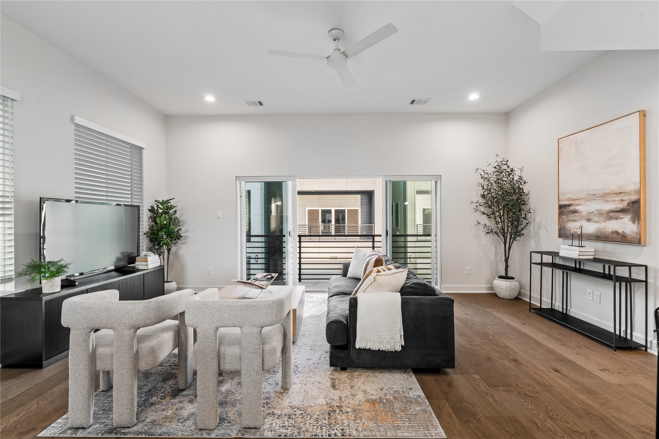 4708 Moving Meadows Houston, TX 77018 - Photo 11 of 40 Soaring ceilings and sliding clear doors in your living area gives a rare option to blend the indoor and outdoor elements at your own convenience.