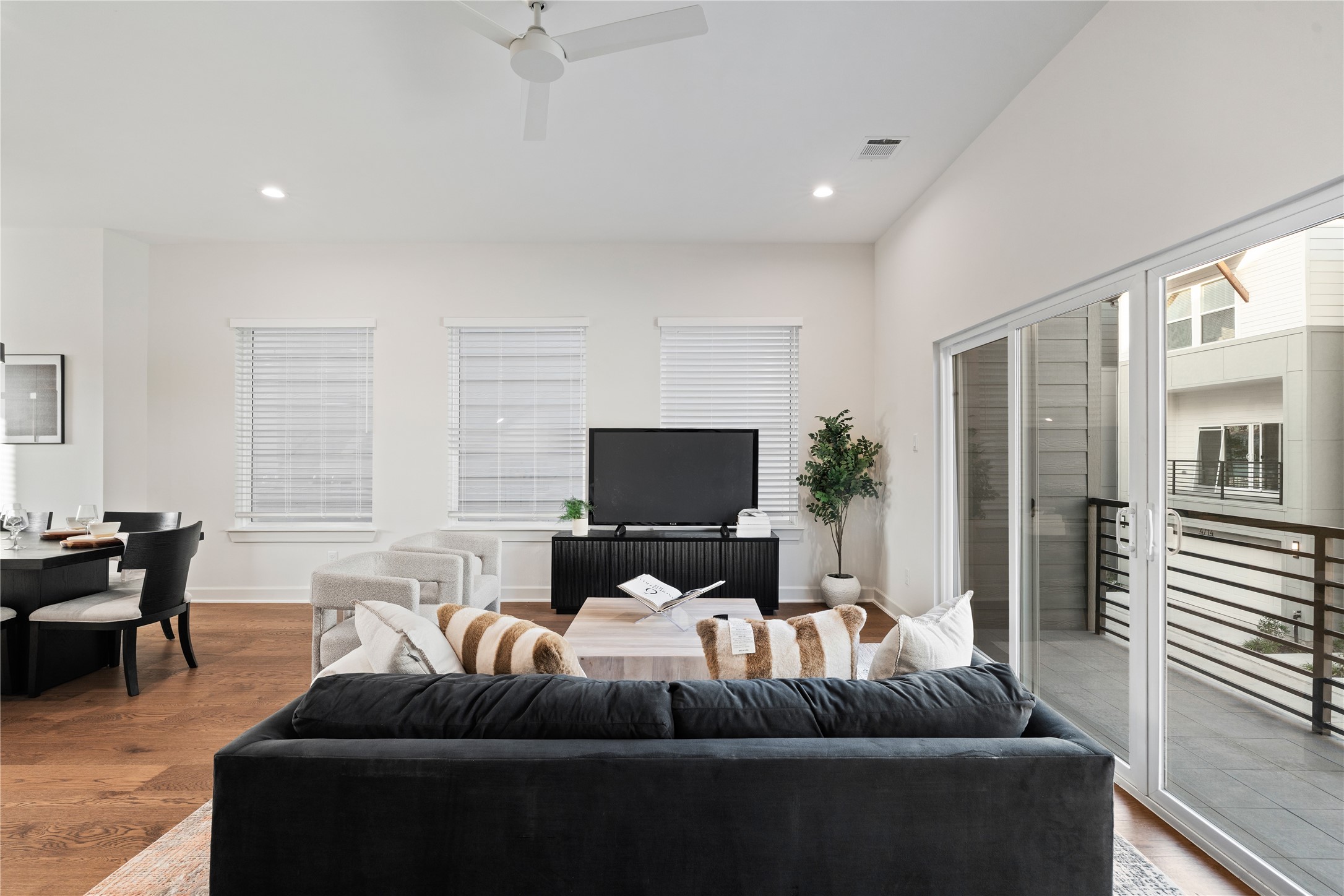 4708 Moving Meadows Houston, TX 77018 - Photo 14 of 40 Easy access from the spacious living room to the covered balcony allows for an indoor-outdoor feel with the french doors.
