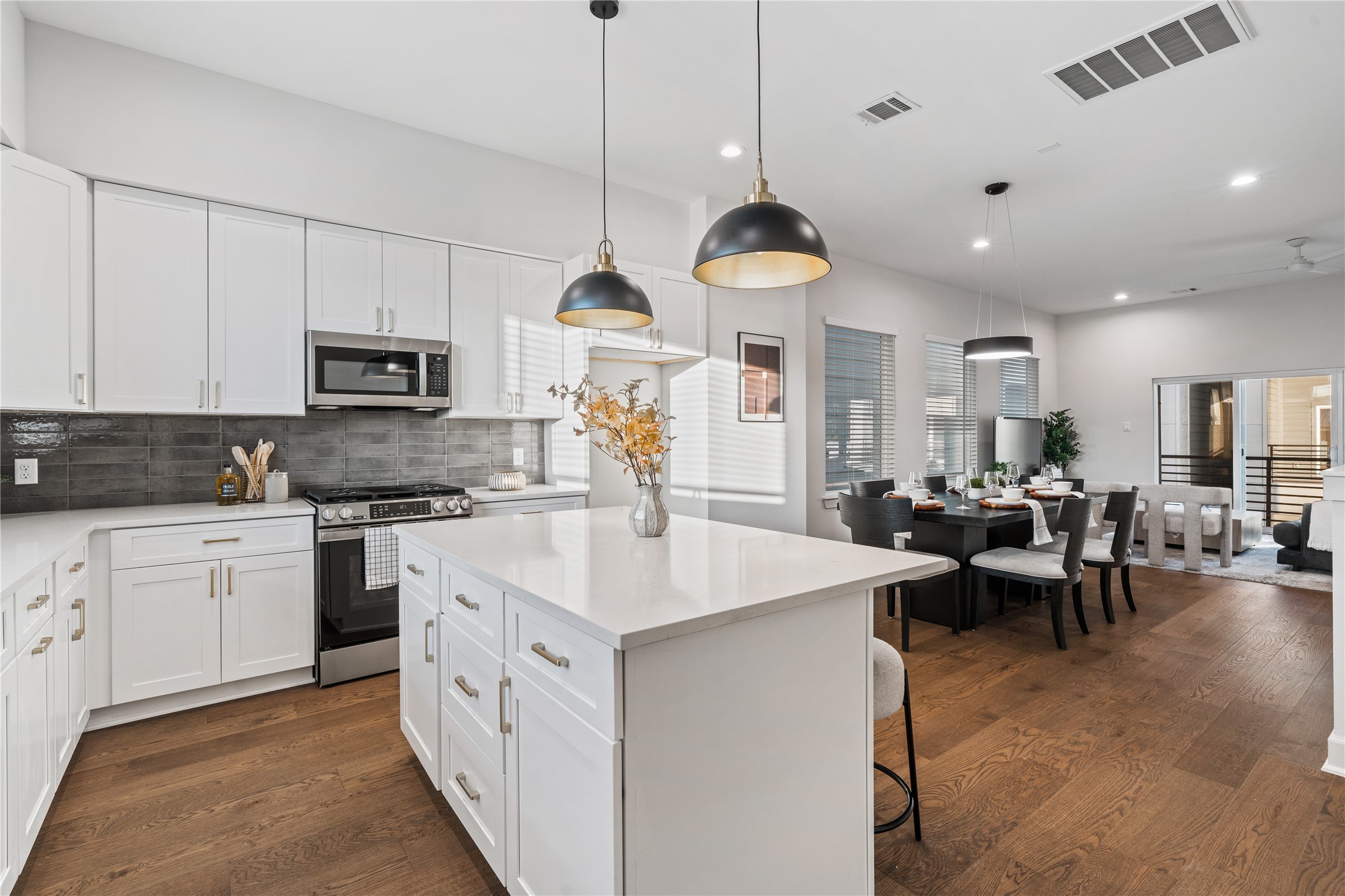 4708 Moving Meadows Houston, TX 77018 - Photo 21 of 40 With its seamless flow, the home allows you to cook in the kitchen and still be part of what’s happening in the dining or living room.