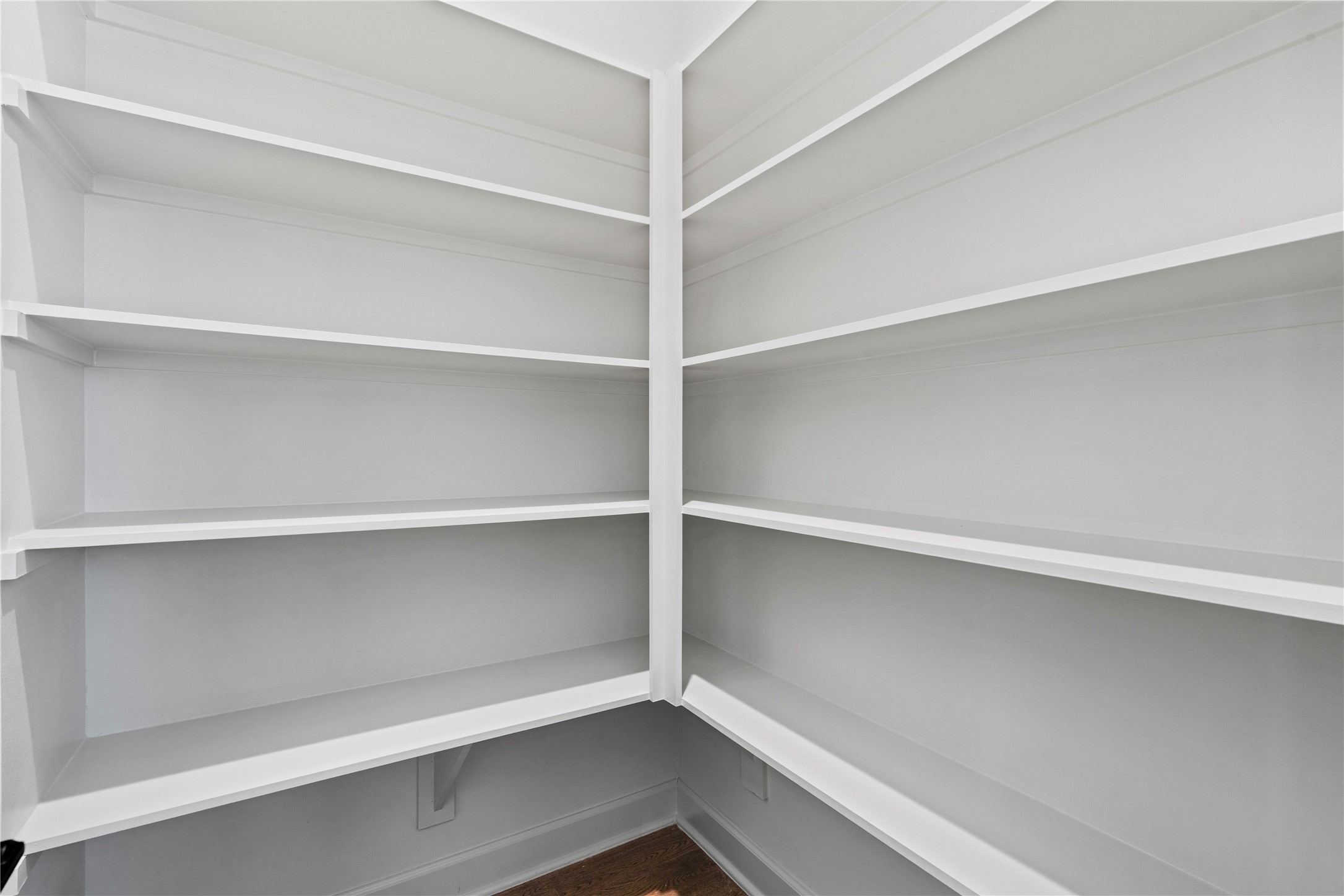 4708 Moving Meadows Houston, TX 77018 - Photo 23 of 40 The walk-in pantry features built-in shelving, offering a clean and organized space for all your kitchen essentials.