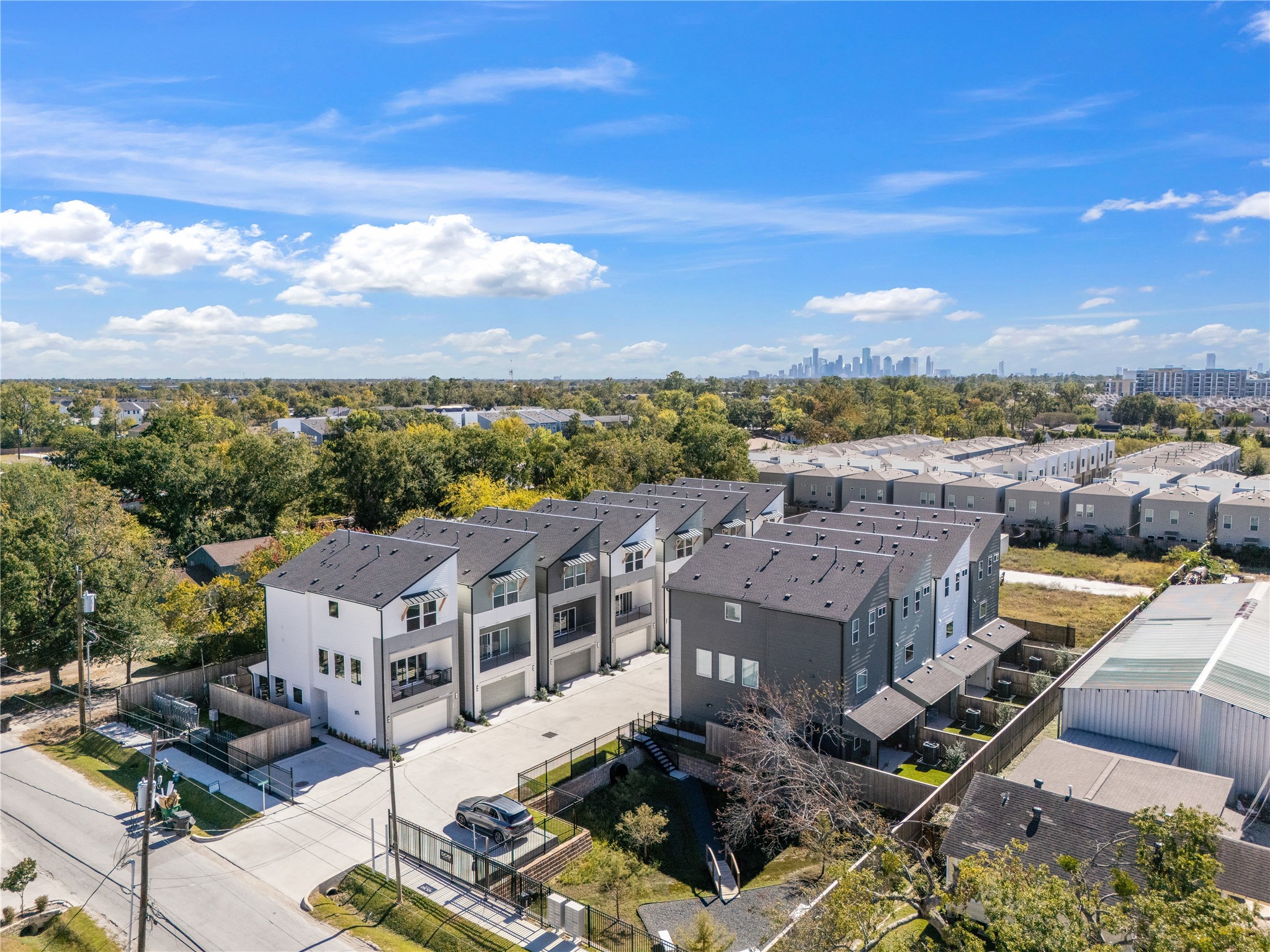 4708 Moving Meadows Houston, TX 77018 - Photo 3 of 40 Dedicated dog park offers residents a curated outdoor amenity—an added convenience for pet-friendly living inside a gated community centralized to city living at your fingertips.