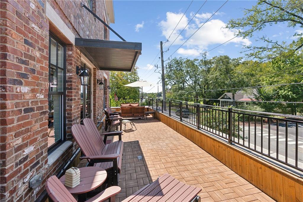 a view of balcony with furniture and outdoor seating