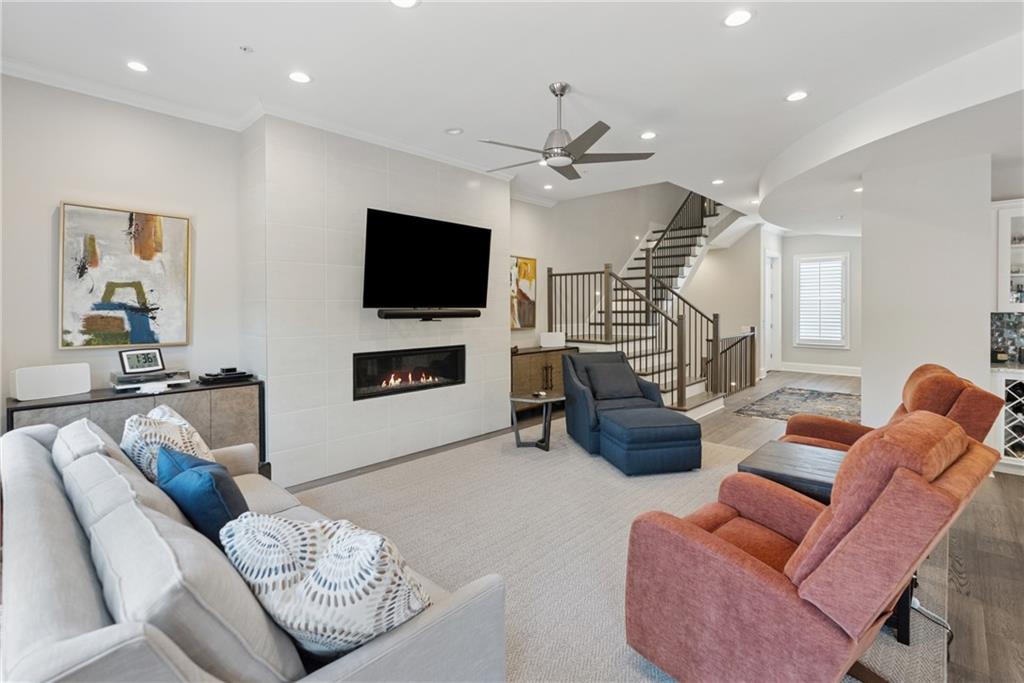 8255 Main Street, Unit 2 Woodstock, GA 30188 - Photo 12 of 46 a living room with furniture and a flat screen tv