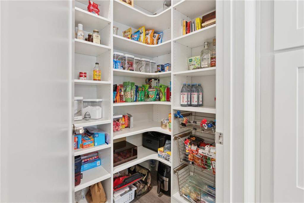 8255 Main Street, Unit 2 Woodstock, GA 30188 - Photo 18 of 46 a room with furniture and a book shelf