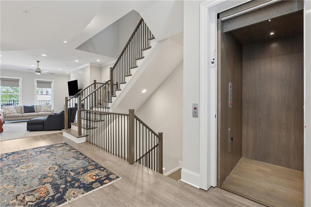 8255 Main Street, Unit 2 Woodstock, GA 30188 - Photo 2 of 46 a view of entryway and hall with wooden floor