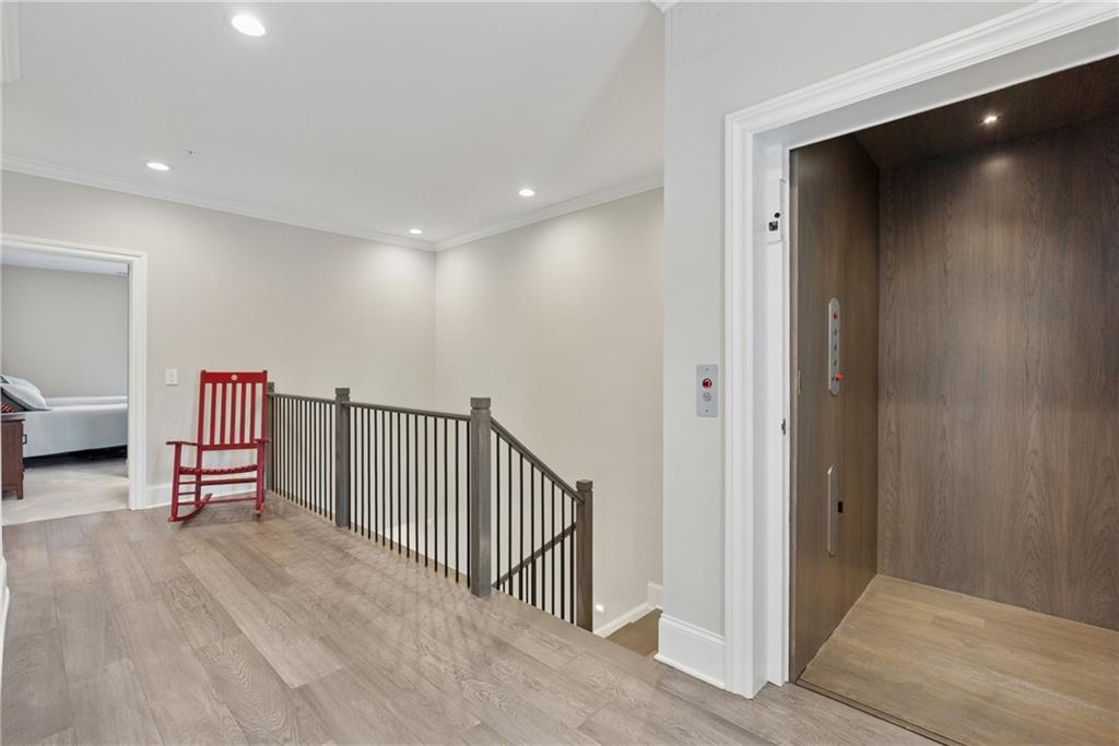 8255 Main Street, Unit 2 Woodstock, GA 30188 - Photo 23 of 46 a view of entryway with stairs and furniture