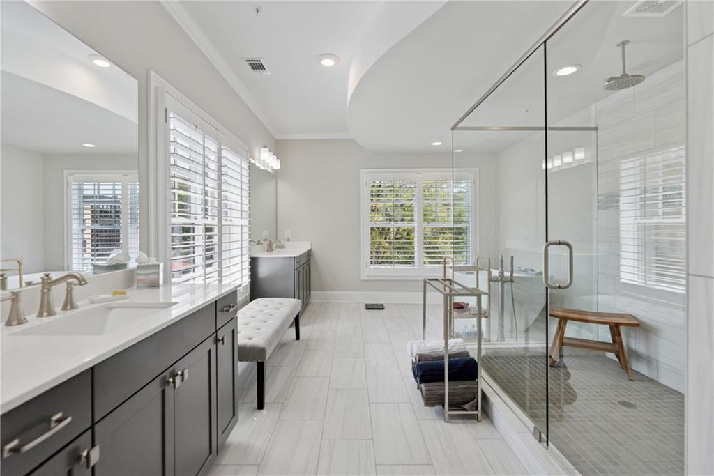 8255 Main Street, Unit 2 Woodstock, GA 30188 - Photo 30 of 46 a living room with furniture a flat screen tv and windows