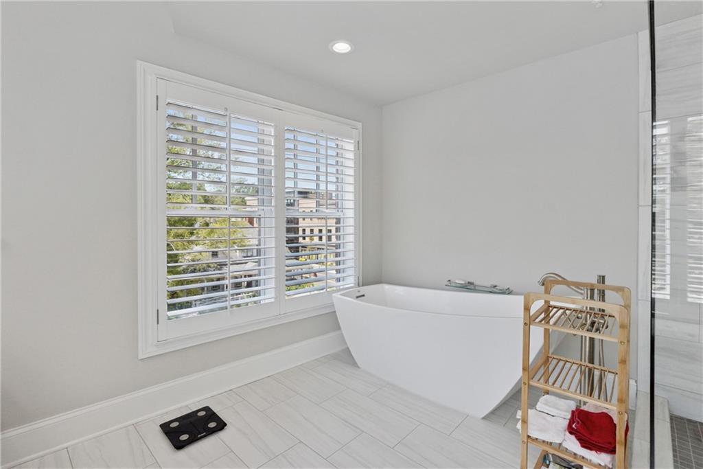 8255 Main Street, Unit 2 Woodstock, GA 30188 - Photo 31 of 46 a living room with furniture and a window