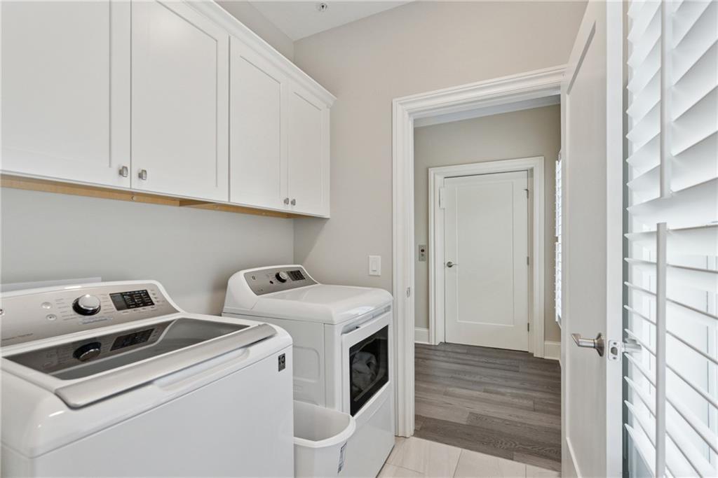 8255 Main Street, Unit 2 Woodstock, GA 30188 - Photo 36 of 46 a utility room with dryer and washer