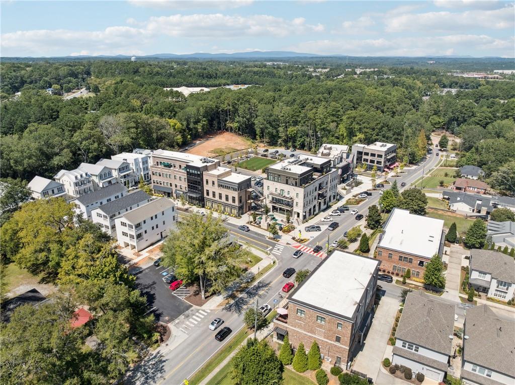 8255 Main Street, Unit 2 Woodstock, GA 30188 - Photo 39 of 46 an aerial view of a house with a lake view