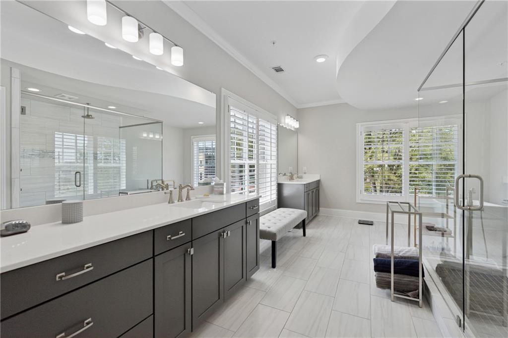 8255 Main Street, Unit 2 Woodstock, GA 30188 - Photo 4 of 46 a spacious bathroom with a double vanity sink and mirror