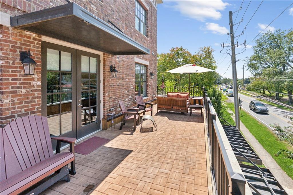 8255 Main Street, Unit 2 Woodstock, GA 30188 - Photo 6 of 46 a building outdoor space with patio furniture