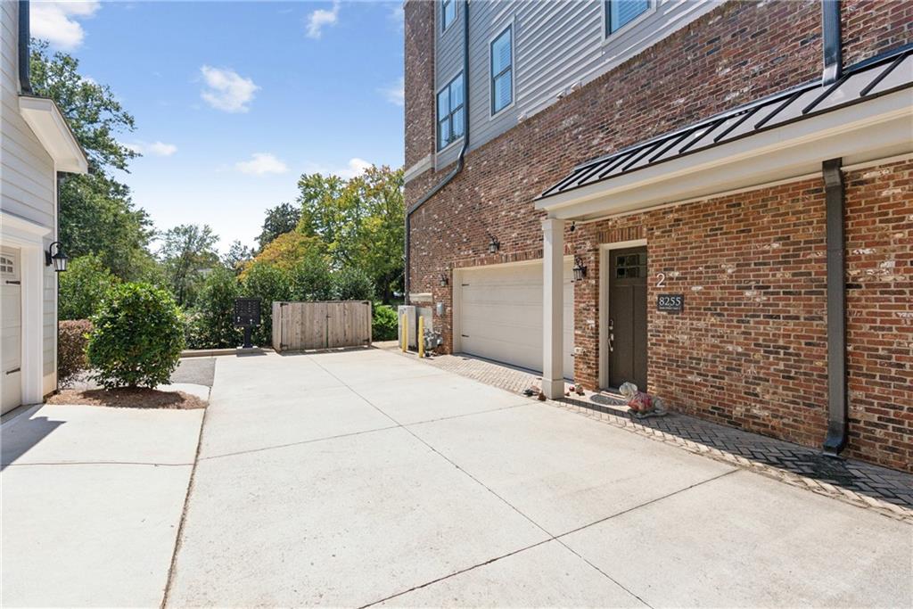 8255 Main Street, Unit 2 Woodstock, GA 30188 - Photo 7 of 46 a view of house with backyard and sitting area