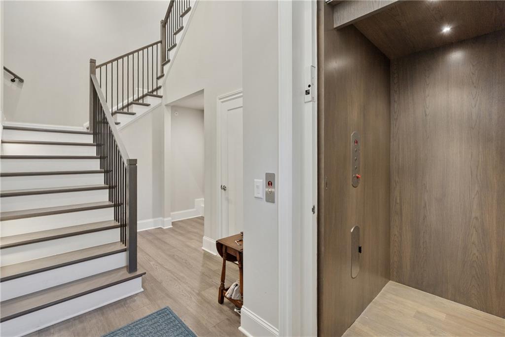 8255 Main Street, Unit 2 Woodstock, GA 30188 - Photo 9 of 46 a view of entryway with wooden floor
