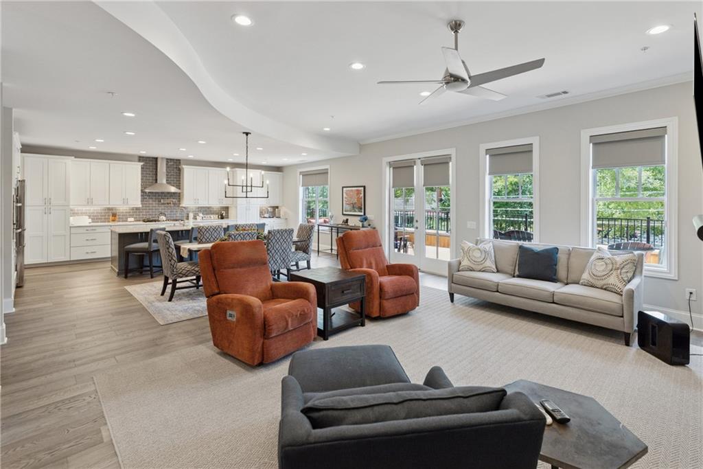 8255 Main Street, Unit 2 Woodstock, GA 30188 - Photo 10 of 46 a living room with furniture kitchen view and a large window