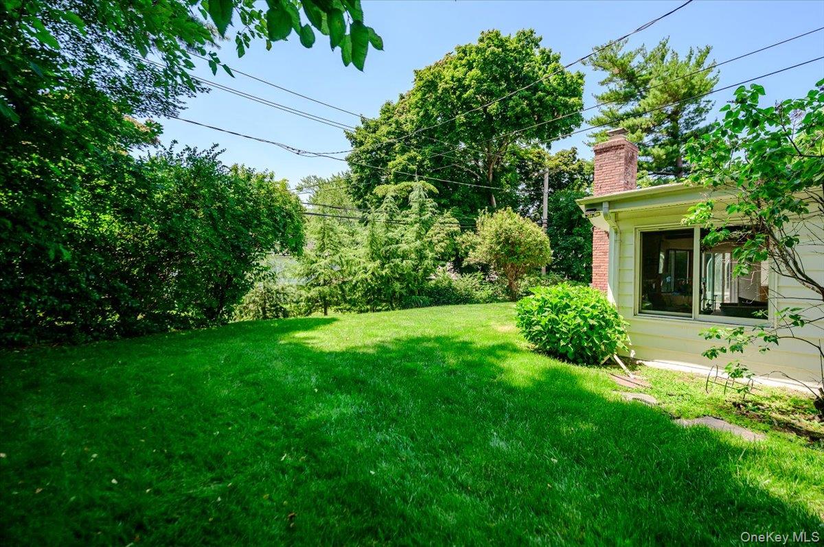70 Longfellow Road Great Neck, NY 11023 - Photo 26 of 28 a view of house with a yard