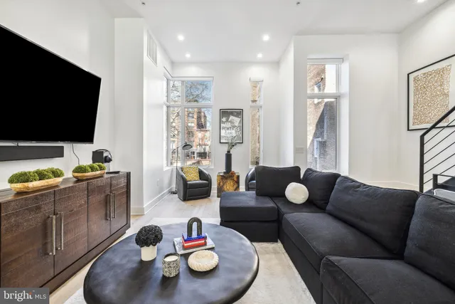 a living room with furniture and a window