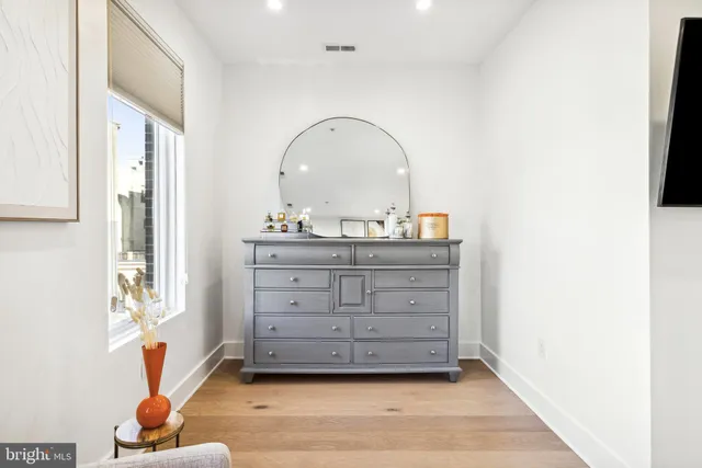 a bathroom with a double vanity sink and mirror