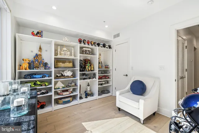a bathroom with a toilet a sink and a mirror