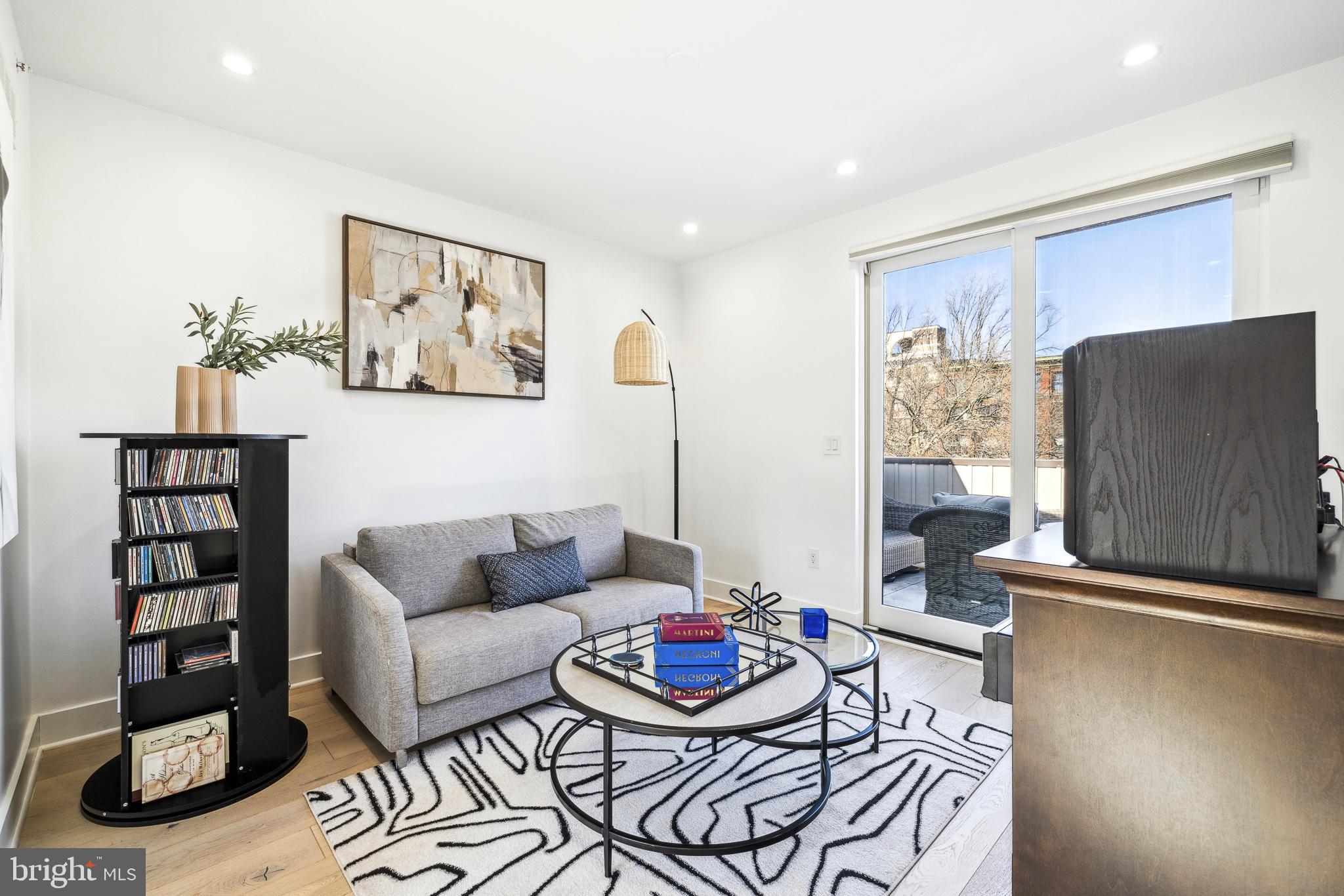 48 North 3rd Street, Unit 3 Philadelphia, PA 19106 - Photo 27 of 36 a living room with furniture and a flat screen tv