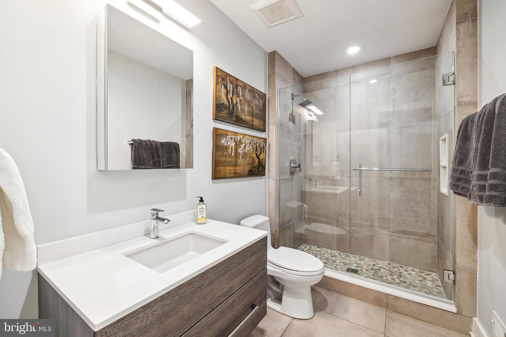 48 North 3rd Street, Unit 3 Philadelphia, PA 19106 - Photo 32 of 36 a bathroom with a sink toilet a mirror and shower