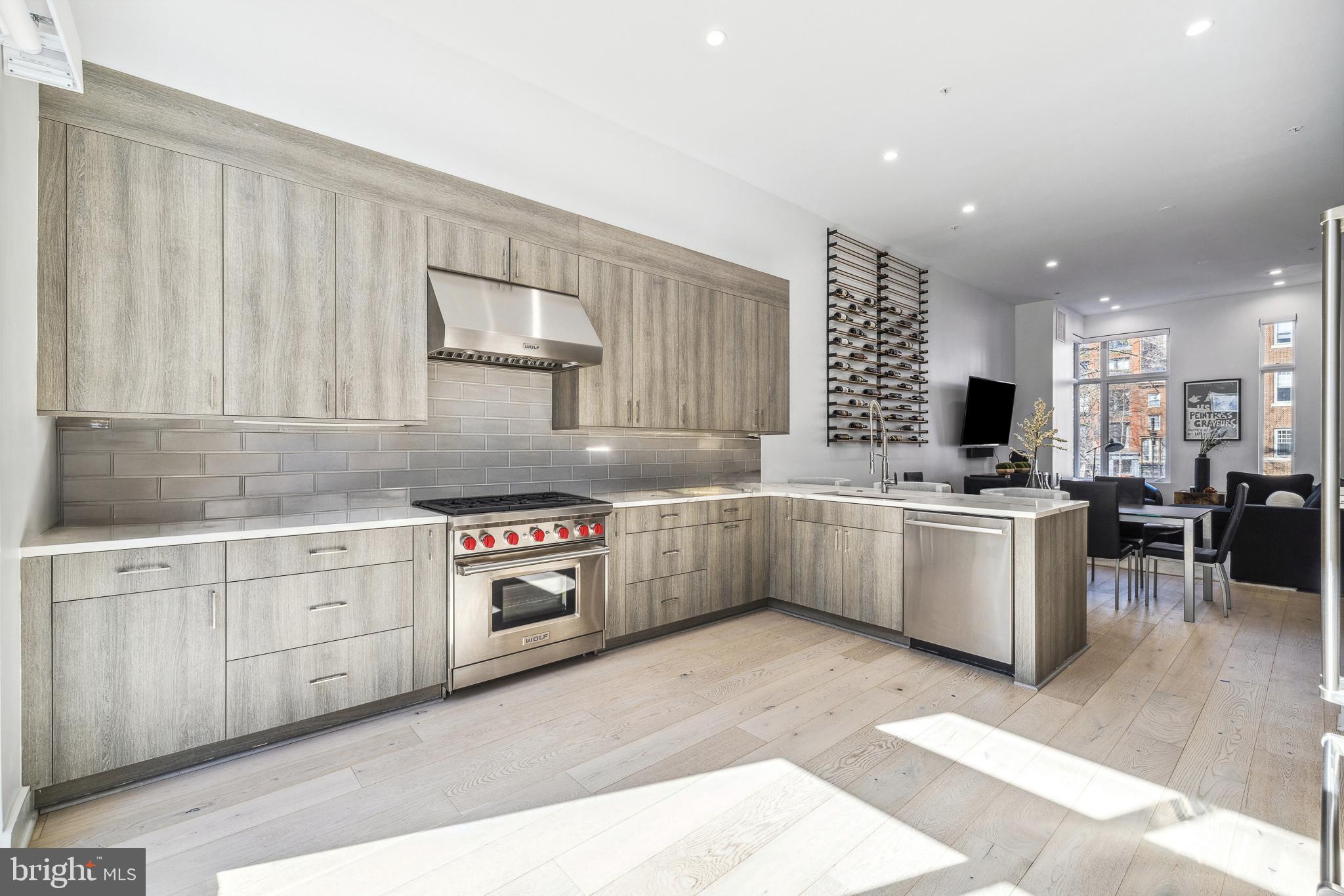 48 North 3rd Street, Unit 3 Philadelphia, PA 19106 - Photo 8 of 36 a kitchen with a sink stove and cabinets