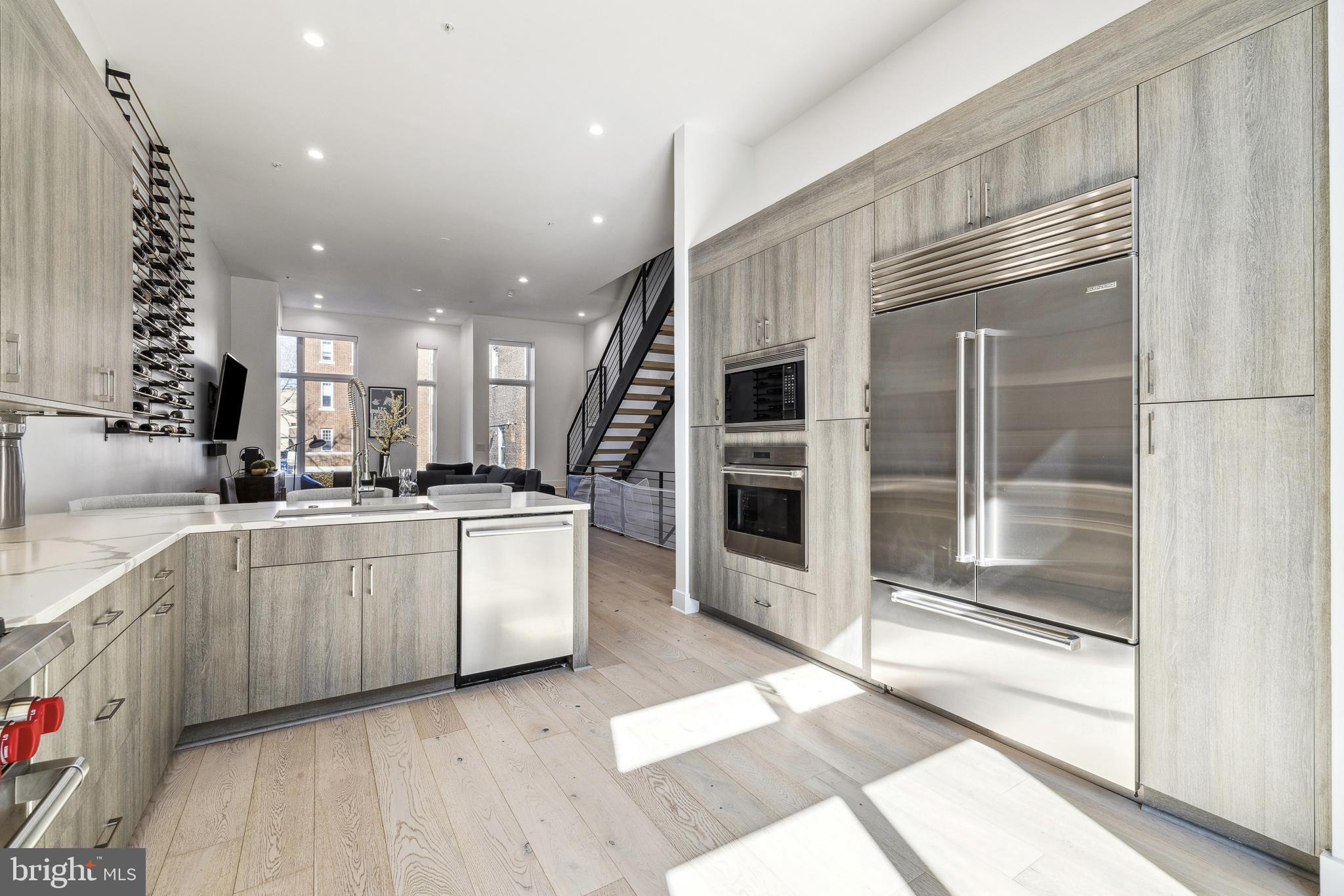 48 North 3rd Street, Unit 3 Philadelphia, PA 19106 - Photo 10 of 36 a large white kitchen with a large window