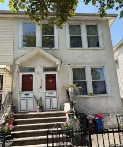 a front view of house with street