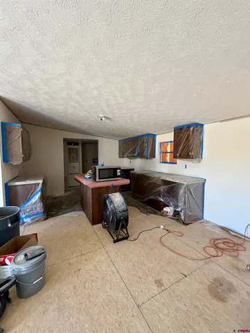 a bedroom with furniture and a bed