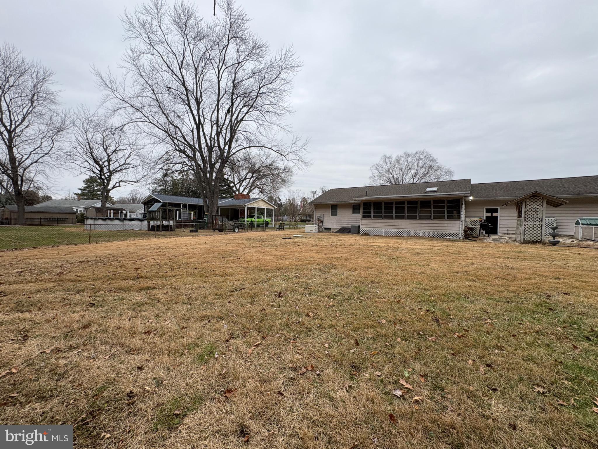 152 Pine Bluff Road Felton, DE 19943 - Photo 4 of 16 Spacious yard with mature trees and charm.