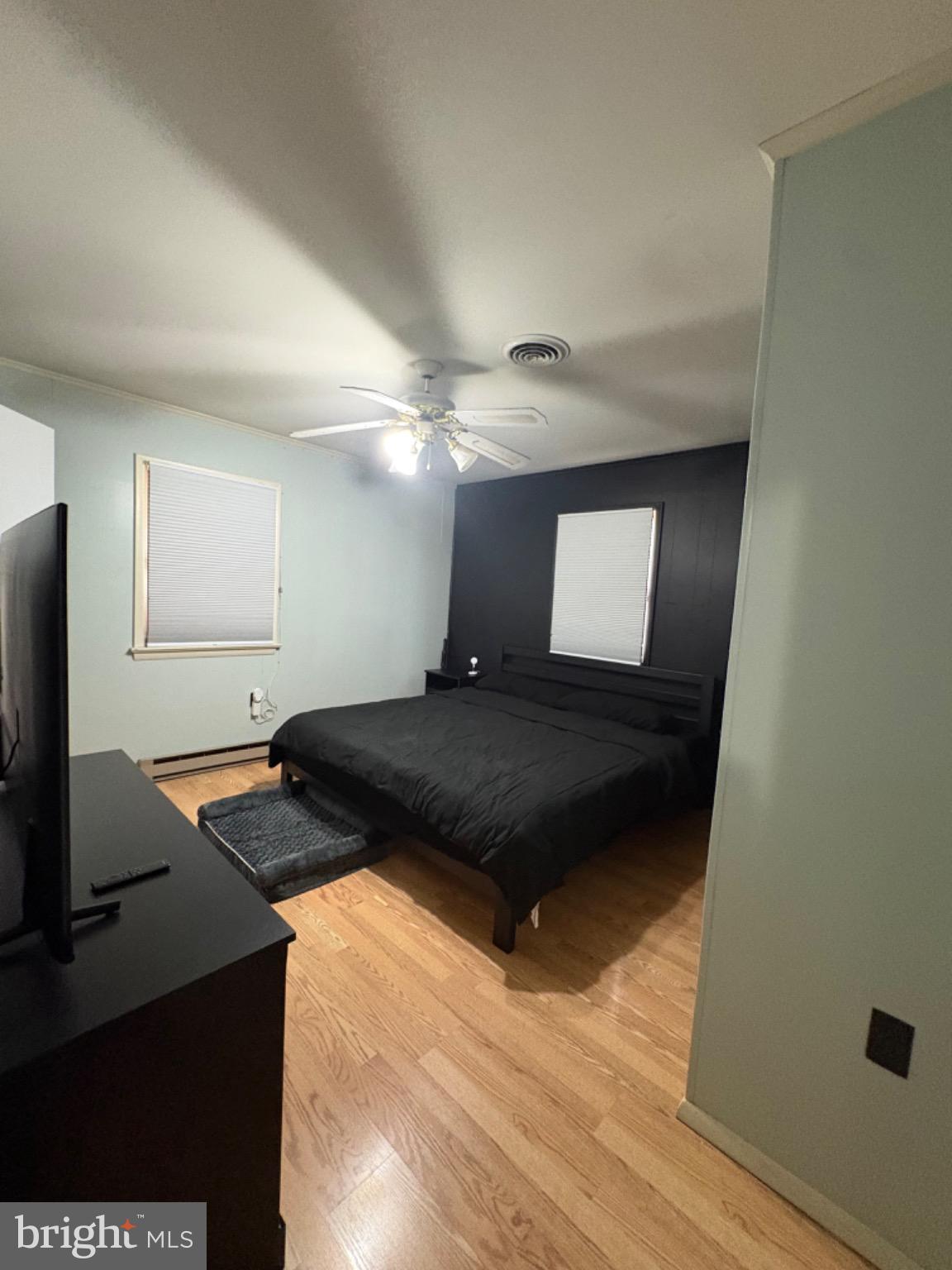 152 Pine Bluff Road Felton, DE 19943 - Photo 9 of 16 Modern bedroom with sleek design elements.