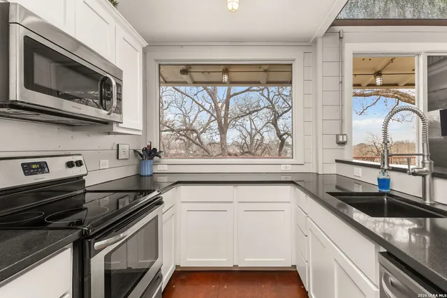 a refrigerator freezer sitting inside of a kitchen