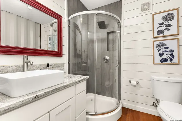 a kitchen with stainless steel appliances granite countertop a refrigerator and a stove