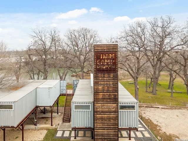 a view of a patio with two chairs and a table