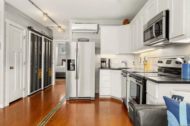 a bedroom with a bed and a table