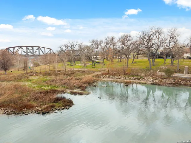a swimming pool with outdoor seating and yard