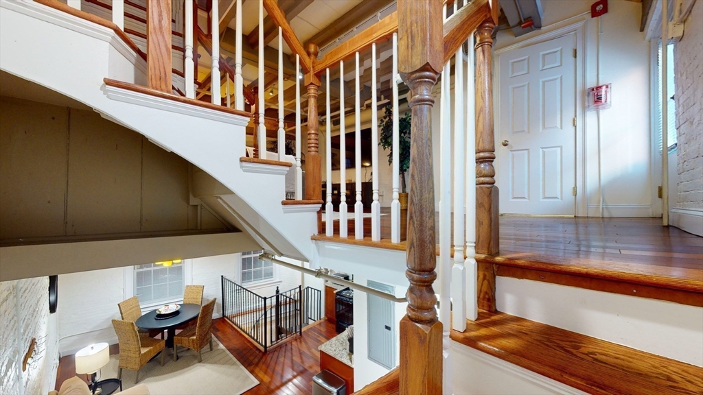 15 Union Street, Unit 4 Boston, MA 02108 - Photo 8 of 18 a view of balcony with two chairs and a potted plant