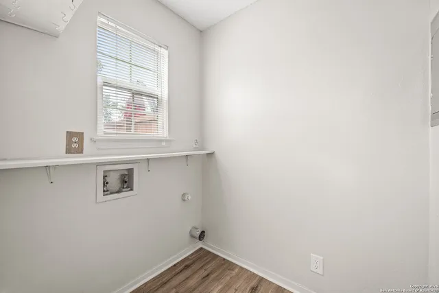 a view of a room that has a window in it