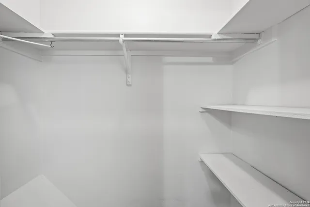 a view of an empty walk in closet