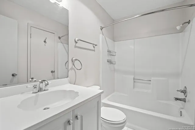 a bathroom with a sink toilet tub and shower
