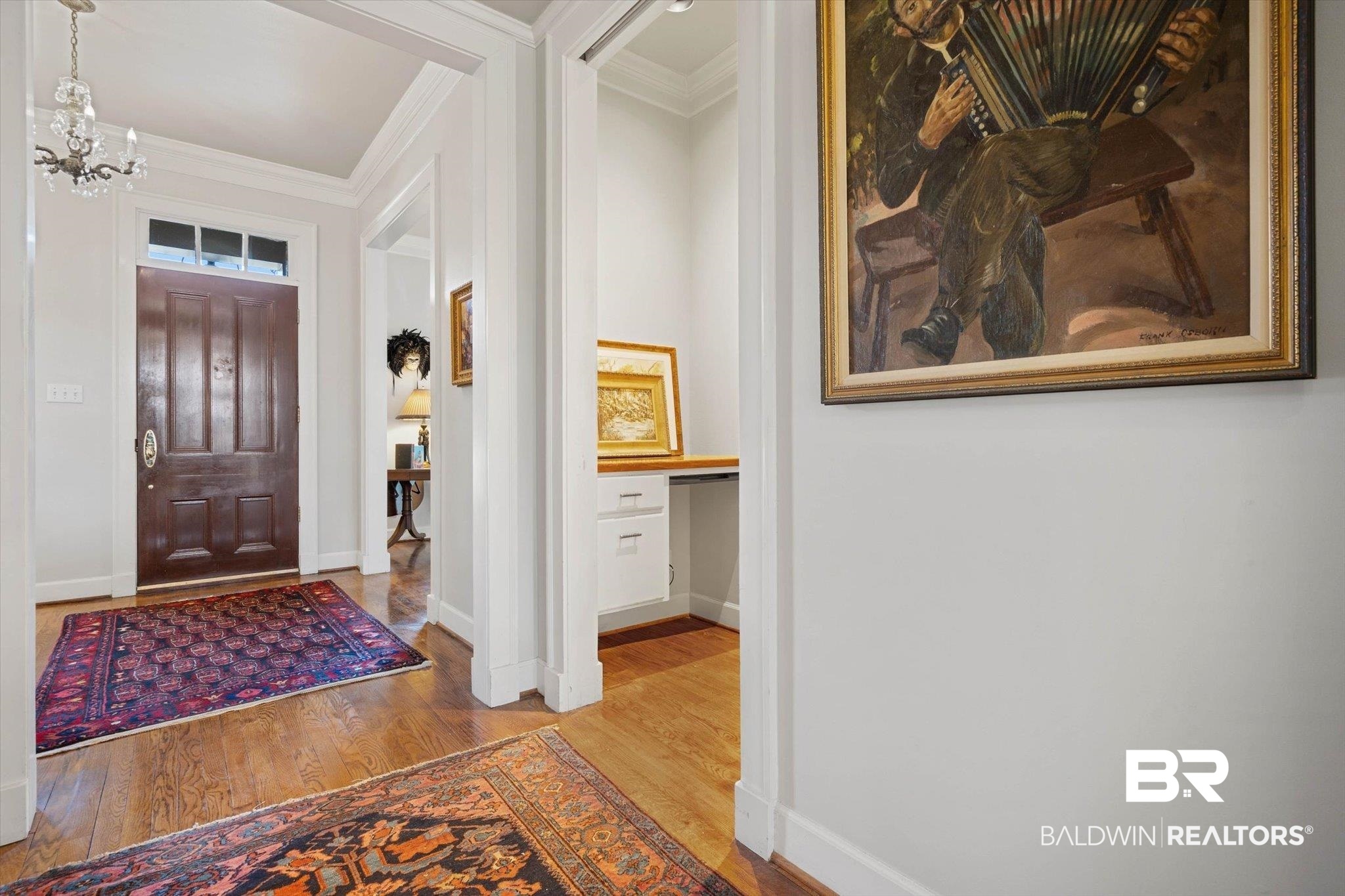 3615 Stein Street Mobile, AL 36608 - Photo 6 of 44 Entryway featuring ornamental molding, hardwood / wood-style flooring, and a chandelier