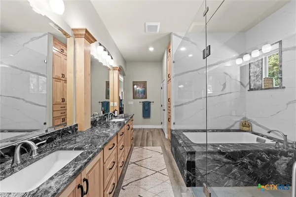 a bathroom with a toilet a sink and a mirror