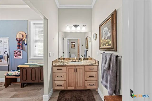 a bathroom with a sink a vanity and a mirror