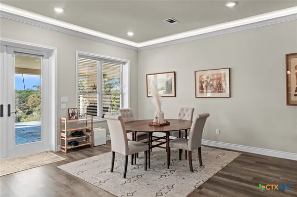 a kitchen with stainless steel appliances granite countertop a sink refrigerator and cabinets