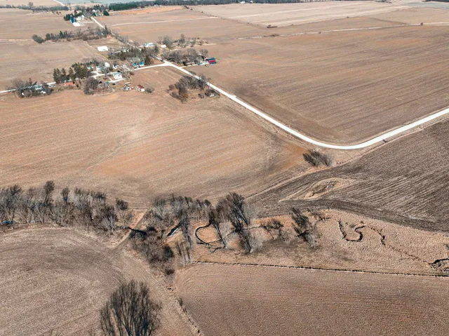 a view of open space with wooden fence