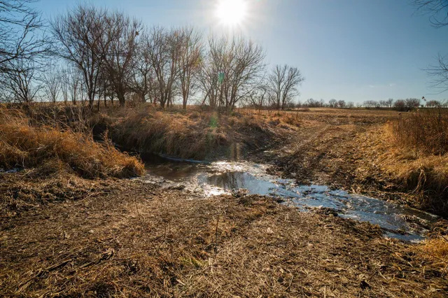 a bathroom with a shower and a sink