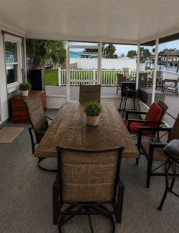 1623 Wavecrest Street Merritt Island, FL 32952 - Photo 21 of 26 a outdoor dining space with furniture and outdoor view
