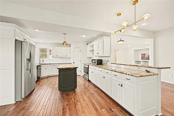 $450,000 | 1012 Northeast Barnes Drive, Lee's Summit, MO 64086