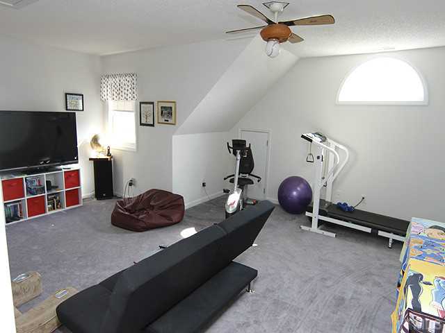 2504 Bulmer Terrace Raleigh, NC 27615 - Photo 8 of 12 a room with furniture and a flat screen tv